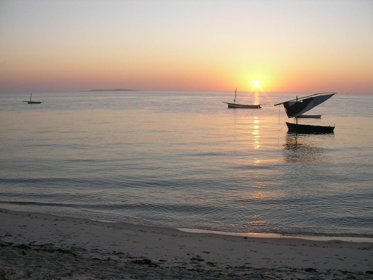 A dhow sailing boat at dawn off Vilanculos, looking toward Bazaruto Island on Mozambique’s Indian Ocean coast