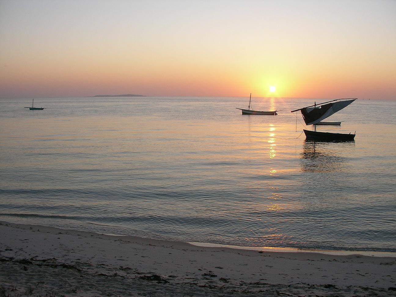 A dhow sailing boat at dawn off Vilanculos, looking toward Bazaruto Island on Mozambique’s Indian Ocean coast