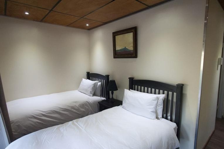 A twin room in the Mountainside Economy rooms at Maliba Mountain Lodge