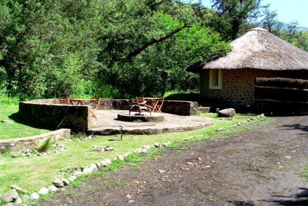 Riverside Huts beside their boma fire area at Maliba